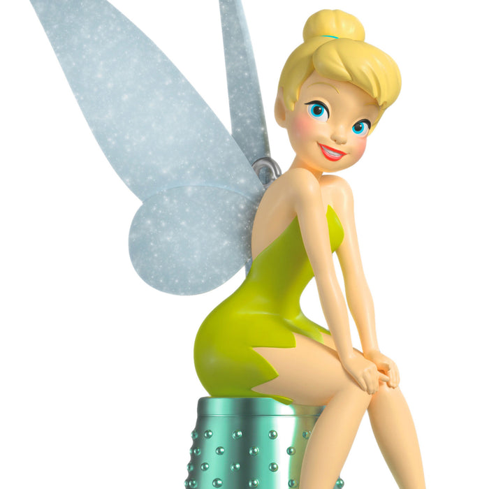 Animated character with fairy wings and green dress on a white background