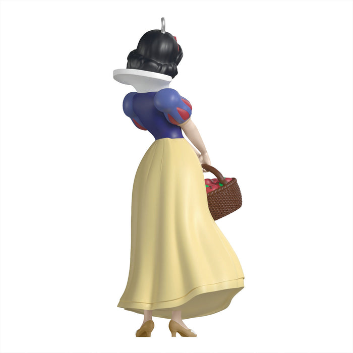 Snow White figurine holding a basket on a white background