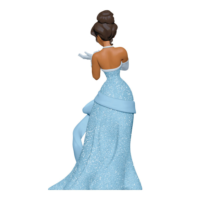 Figurine of a princess in a blue gown on a white background