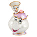 Animated character figurine with a white face, gold accents, and colorful dress on a white background