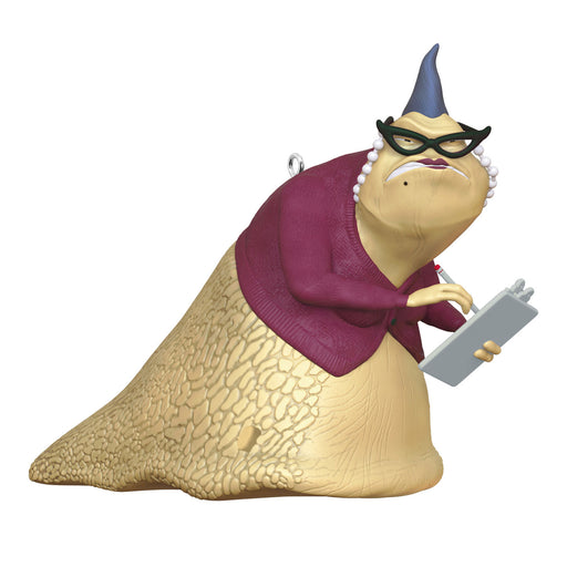 Animated character figurine with a purple sweater and glasses holding a clip board on a white background