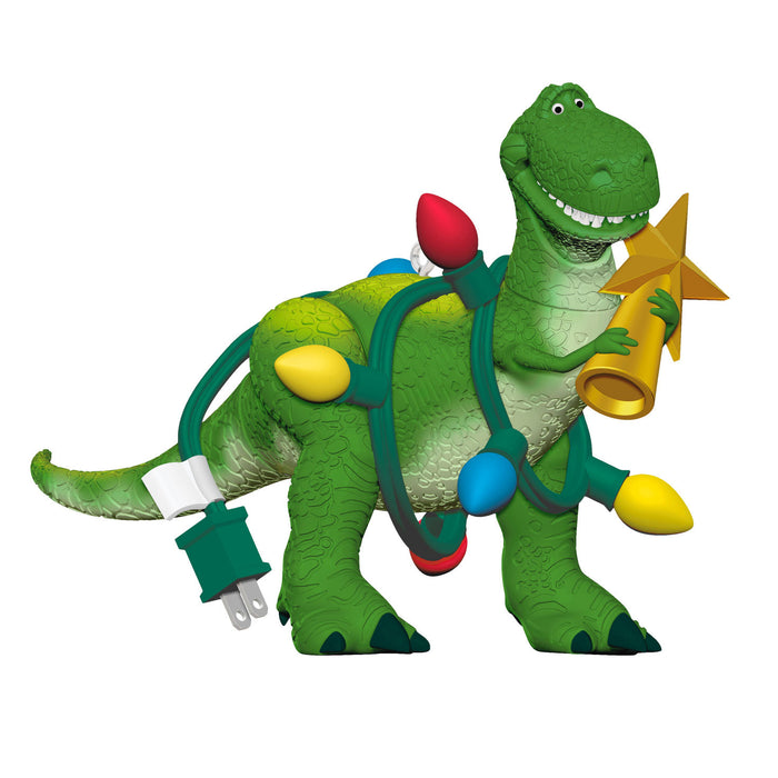 Toy dinosaur with Christmas lights and decorations on a white background