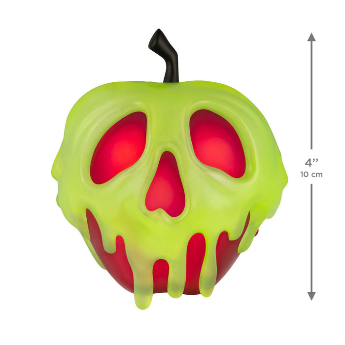Green and red apple-shaped object with a skull design on a white background