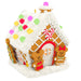 Gingerbread house with candy decorations on a white background