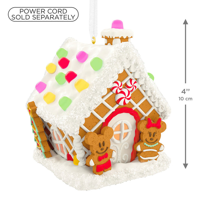 Gingerbread house with candy decorations and dimensions on a white background