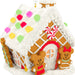 Gingerbread house with candy decorations and gingerbread men on a white background