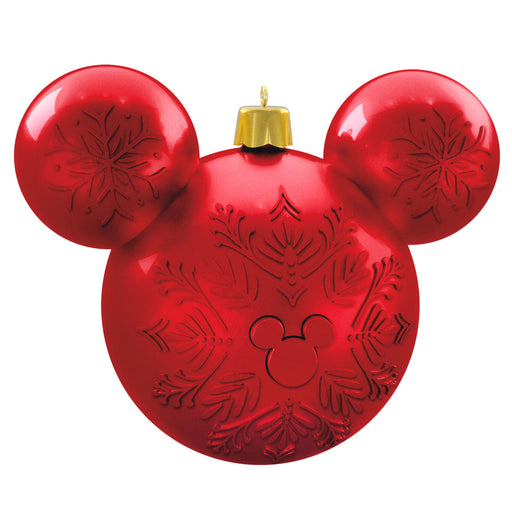 Red ornament shaped like a mouse head with snowflake patterns on a white background
