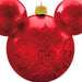 Red ornament shaped like a Mickey Mouse head with snowflake patterns on a white background
