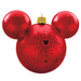 Red ornament shaped like a character with gold top on a white background
