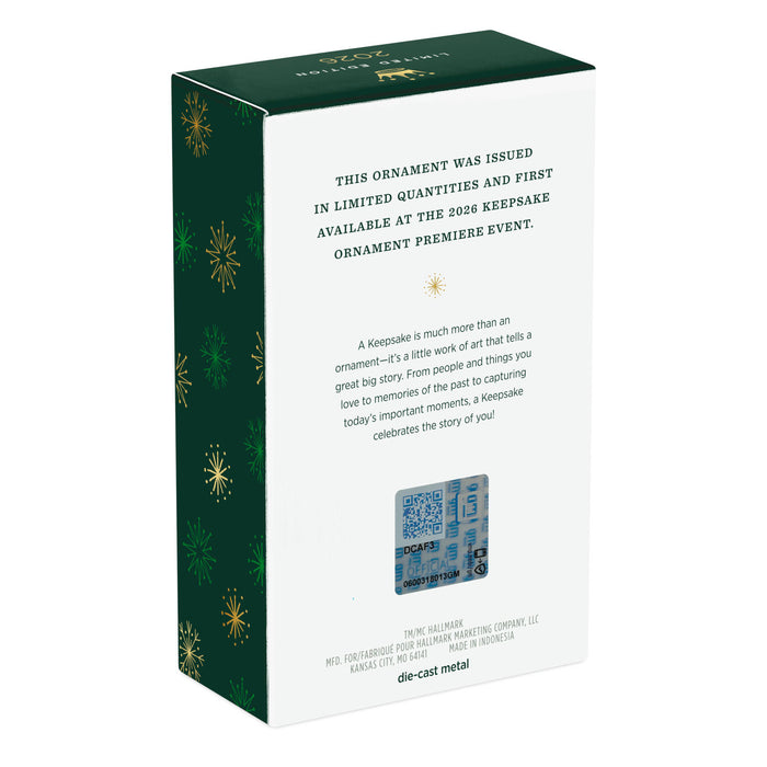 Boxed Christmas ornament with green and white design on a white background