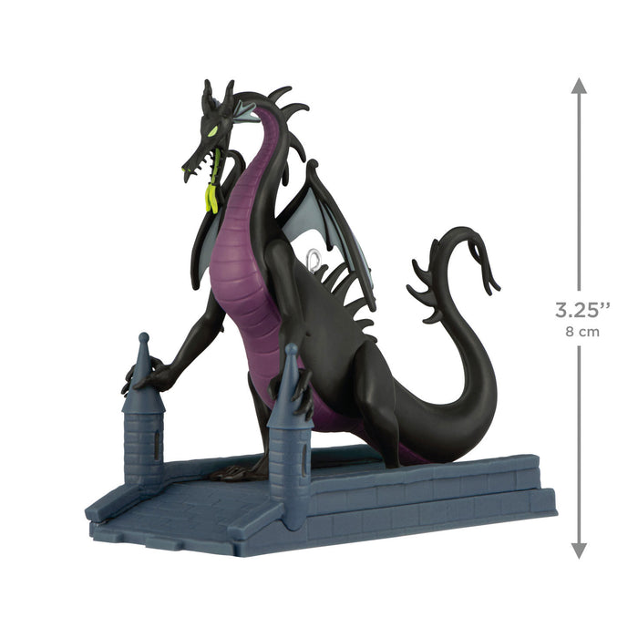 Dragon figurine with a castle base, showing measurements on a white background