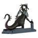 Black dragon figurine holding a bottle on a white background