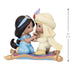 Two figurines of a princess and a prince on a magic carpet with a measurement indicator.