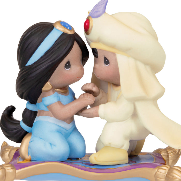 Two figurines of a young girl and a monkey on a white background