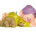 Toy figure of a sleeping gnome with a purple hat on a white background
