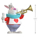 Animated character figurine with a trumpet and measurement details on a white background