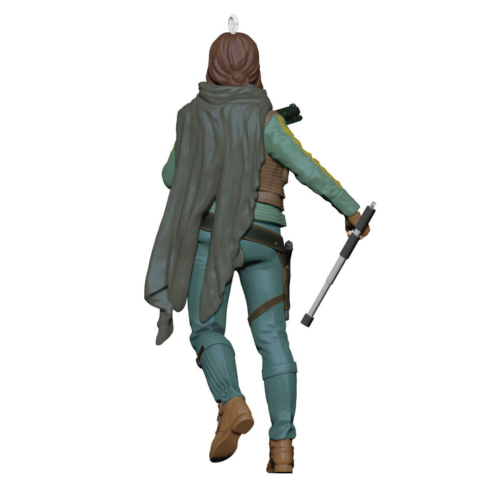 Action figure of a character from 'Star Wars' holding a lightsaber on a white background