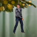 Ornament of a man holding a sword against a blurred green background