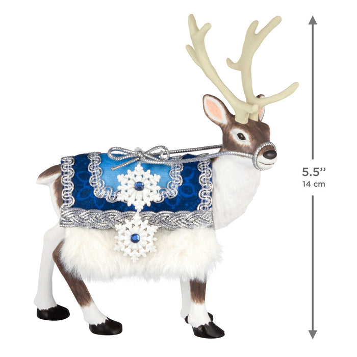 Decorative reindeer figure with a blue and silver patterned cloth around its neck, on a white background with dimensions indicated.
