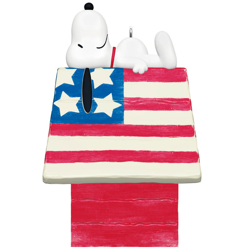 Snoopy figurine on a doghouse with an American flag design