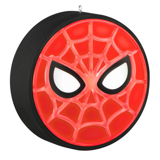 Spider-Man themed yoyo with red face and black web design on a white background