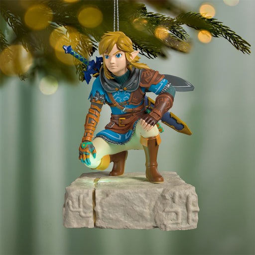 Decorative figurine of a character from a video game hanging on a Christmas tree.