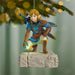 Decorative figurine of a character from a video game hanging on a Christmas tree.