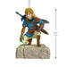 Figure of a character from a video game with measurements on a white background