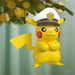 Pikachu ornament wearing a captain's hat on a Christmas tree