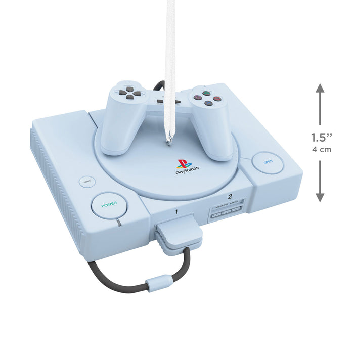 PlayStation console with controller ornament on a white background