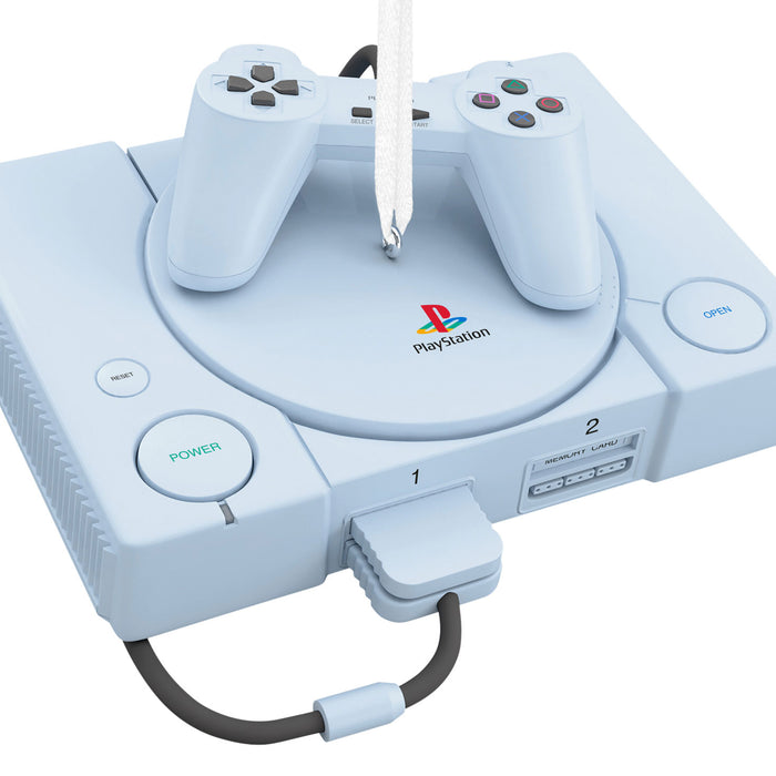 White PlayStation console with controller ornament on a white background