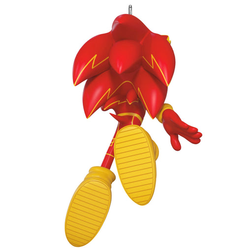 Red and yellow character figurine on a white background