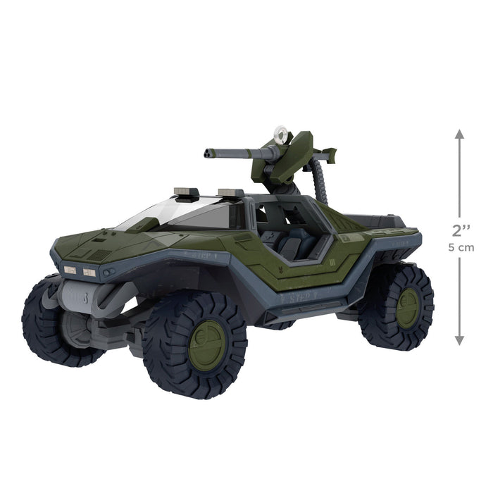 Toy vehicle with green and gray color scheme on a white background