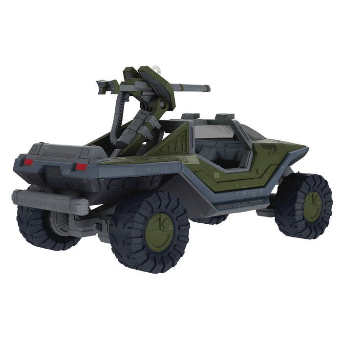 Toy vehicle with a gun on top on a white background