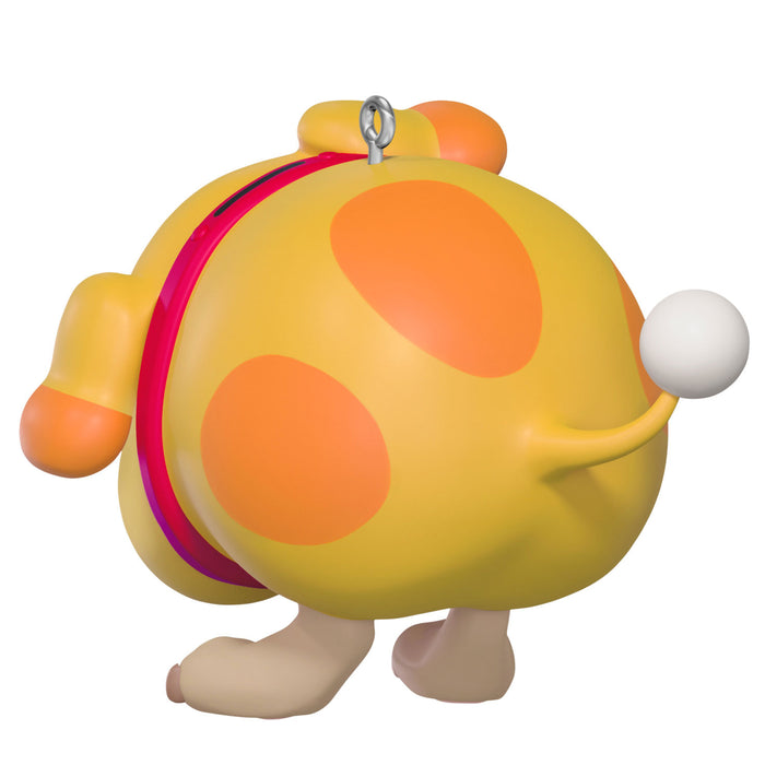 Colorful character figure with a round body and orange spots on a white background