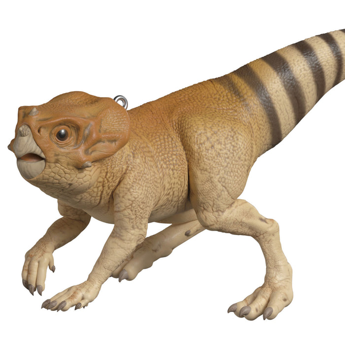 Model of a dinosaur with brown and beige coloration on a white background