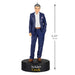 Figurine of a man in a blue suit with 'Schitt's Creek' branding, showing height measurement.