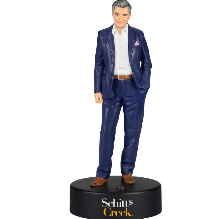 Figurine of a man in a blue suit on a black base with 'Schitt's Creek' branding.
