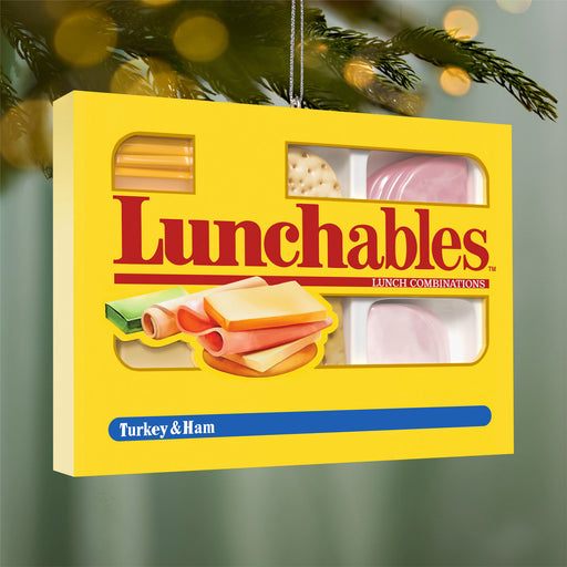Lunchables packaging with visible ingredients on a Christmas tree background