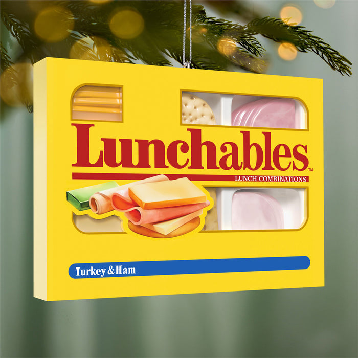 Lunchables packaging with visible ingredients on a Christmas tree background
