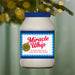Miracle Whip bottle ornament with blue lid against a blurred Christmas tree background
