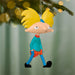 Cartoon character ornament with yellow hair and blue outfit hanging on a Christmas tree.