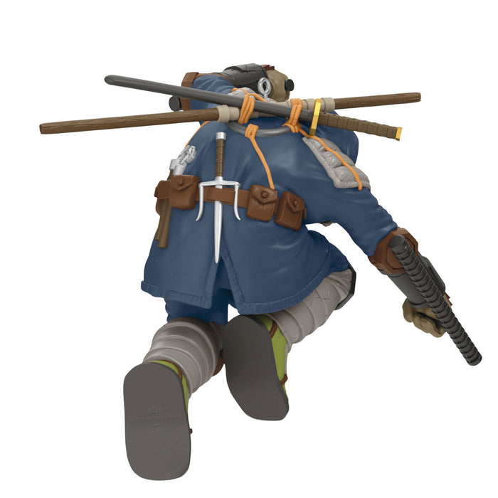 Animated character in blue outfit with a staff on a white background