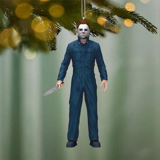 Decorative ornament of a character in blue coveralls holding a knife, hanging from a tree.