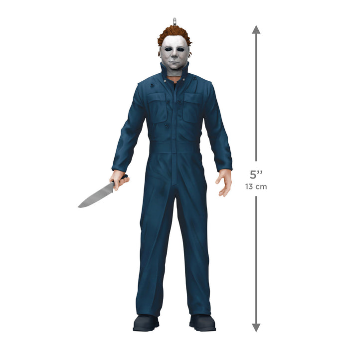 Action figure in blue coveralls with a knife, standing next to a height measurement indicator on a white background.