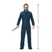 Action figure in blue coveralls with a knife, standing next to a height measurement indicator on a white background.