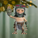 Ornament of a creature with a helmet and armor hanging from a Christmas tree.