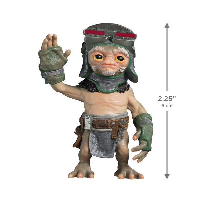 Small figurine with helmet and gloves, showing size measurement on a white background