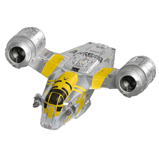 Toy spaceship model with yellow and gray design on a white background