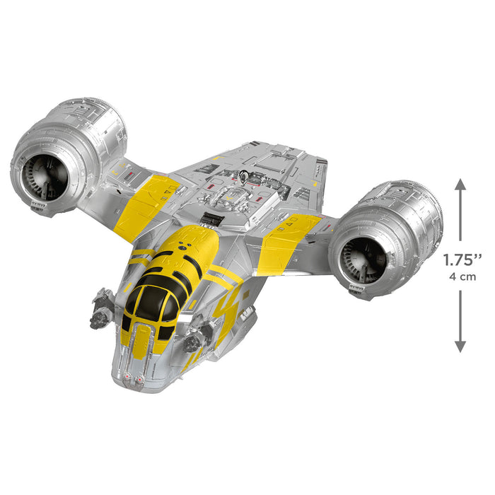 Model of a spaceship with yellow and gray design on a white background